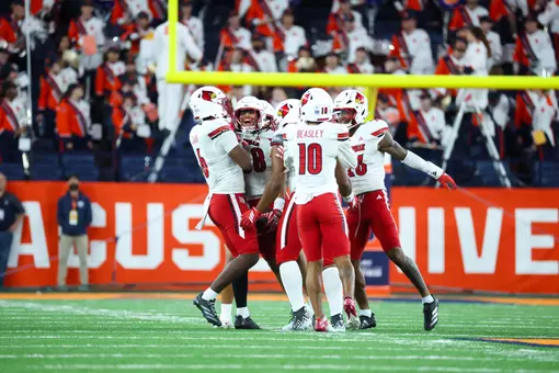 Cards' Defense Celebrates Against Syracuse