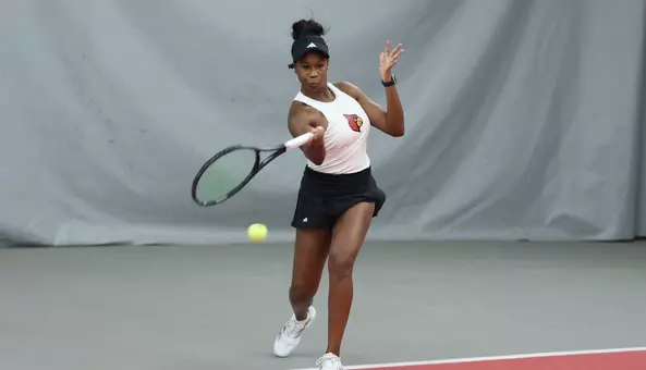 Rebekkah Gaines returns a volley