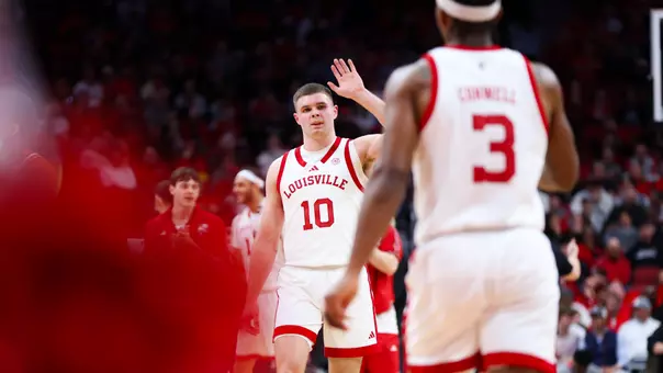 Isaac McKneely high fiving Ryan Conwell