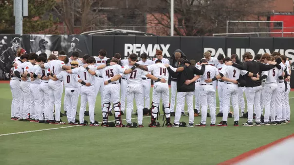 The Cardinals huddle before playing Morehead State.
