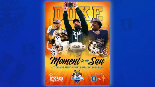 A graphic showing the 2025 Tony the Tiger Sun Bowl Guide Cover with a blue background. Head coach Manny Diaz is the main image on the bowl guide cover as he is hoisting the ACC Championship football in the air.