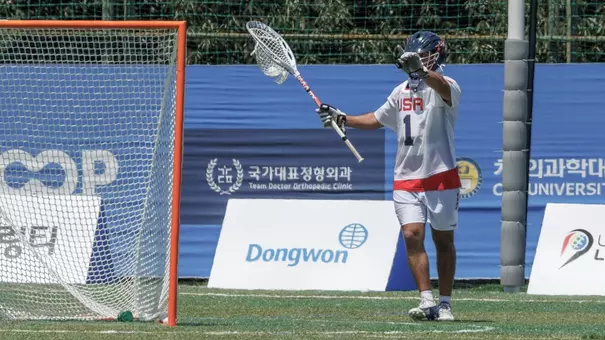 Patrick Jameison directs his defense as the goalie for United States at World Lacrosse Championship