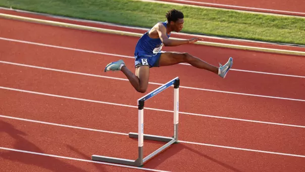 Andres Langston clears a hurdle at the NCAA Outdoor Championships