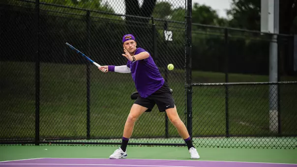 Cosme Rolland De Ravel hits a forehand.
