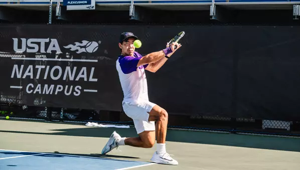 Duncan Chan makes eye contact with a tennis ball as he prepares to hit a slice