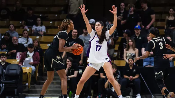 Clara Silva raises her arms outside the paint to defend a passing lane.