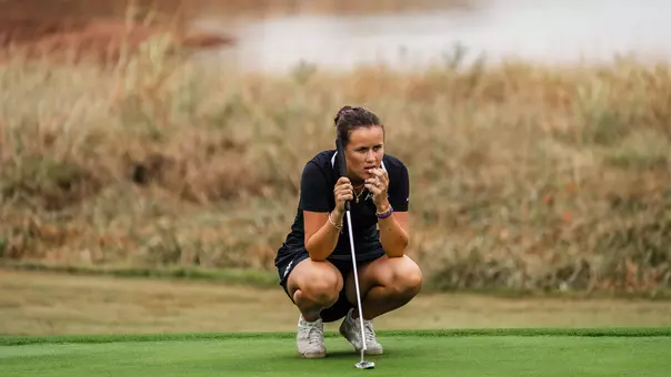 Ella Forss reads the green ahead of a birdie putt attempt.