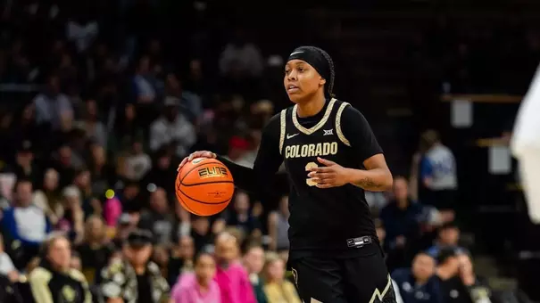 Transfer Desiree Wooten Dribbles the Ball Up the Court