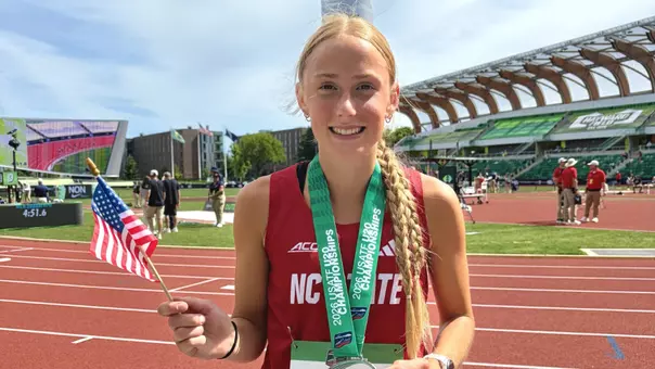 Emily Wisniewski holding an American flag after finishing second in the 5000m at the USATF U20 Championships