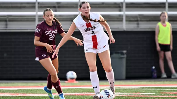 Rachel Kretzer holds off defender to keep possession of the ball
