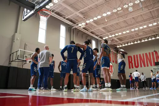 Men's basketball huddles at a practice at the University of Utah