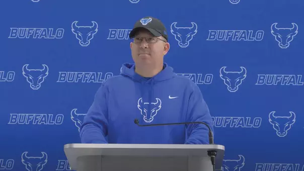 Pete Lembo standing at podium