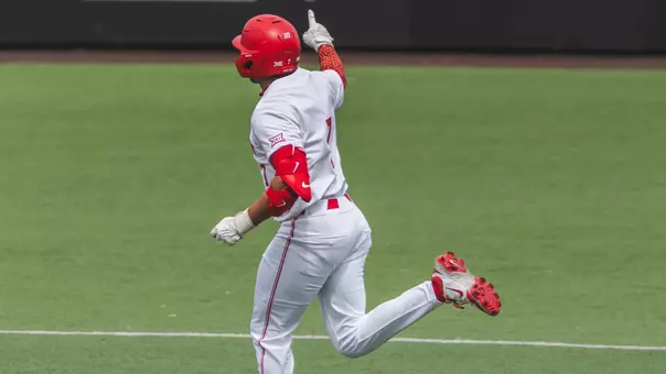 Xavier Perez points while rounding the bases.