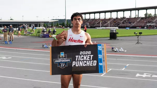 Louie Hinchliffe holding ticket punched sign