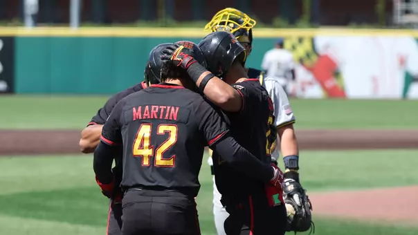 Maryland celebrates a home run against Michigan