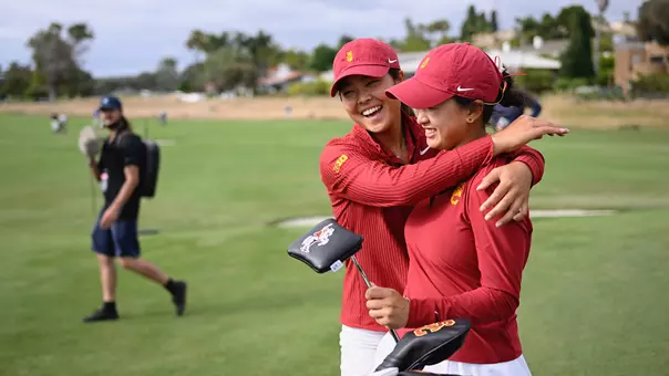 Kylie Chong hugs Elise Lee after USC wins the 2026 NCAA semifinals matchup against Arkansas