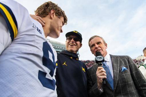 Michigan OL Michael Onwenu in better shape, 'like running through a brick  wall' 