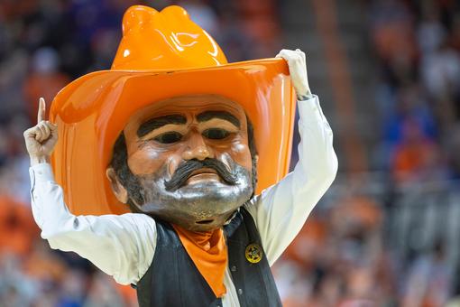 Oklahoma State's Quion Williams (13) brings the ball up the court during  the first half of an NCAA college basketball game against Mississippi in  Stillwater, Okla., Saturday, Jan. 28, 2023. (AP Photo/Mitch