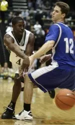 Colorado State guard Cory Lewis, left, passes the ball past Air Force guard Tim Anderson in the second half.