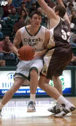 Colorado State's Jason Smith drives the ball past Wyoming's Travis Nelson.