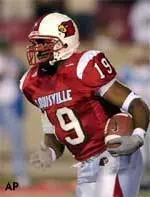 Michael Bush looks for running room as he carries the ball during the first half.