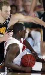 Iowa's Greg Brunner and Louisville's Juan Palacios go for a loose ball in the second half.