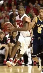 Larry O'Bannon drives the baseline past Michael Hayes of North Carolina A&amp;T.