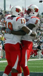 Michael Bush and Josuha Tinch celebrate Bush's 12 yard run for a touchdown in the second quarter against Army.