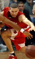 Francisco Garcia reaches for a loose ball in the final minute of Louisville's 77-73 win.