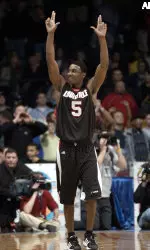 Taquen Dean celebrates the 66-62 win over DePaul in the second half, at the Allstate Arena in Rosemont, Ill, Saturday, March 5, 2005. (AP Photo/Stephen J. Carrera)