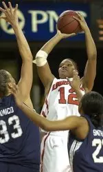 Jazz Covington shoots over the defense of Notre Dame's Melissa D'Amico, left, and Chandrica Smith.