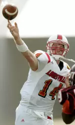 Louisville quarterback Hunter Cantwell throws a pass as Virginia Tech's Carlton Powell rushes in during the first quarter of the Gator Bowl football game, Monday, Jan. 2, 2006, in Jacksonville, Fla. (AP Photo/Phil Coale)