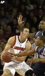 David Padgett is defended by Villanova's Kyle Lowry during first half action. (AP Photo/Timothy D. Easley)