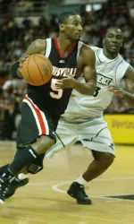 Taquan Dean makes a move to the basket against Providence guard Weyinmi Efejuku during the first half. (AP Photo/Stew Milne)