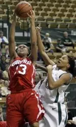 Louisville's Toni Slaughter (13) grabs a first half rebound away from South Florida's ChiChi Okpale. (AP Photo)