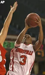 Louisville's Patrika Barlow puts a shot up over the defense of St. John's Tiina Stein in the second half. (AP Photo/Timothy D. Easley)