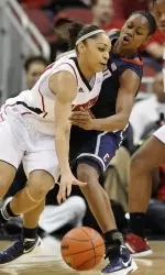 Louisville's Bria Smith, left, drives against Connecticut's Tiffany Hayes during the second half. (AP Photo/Timothy D. Easley)