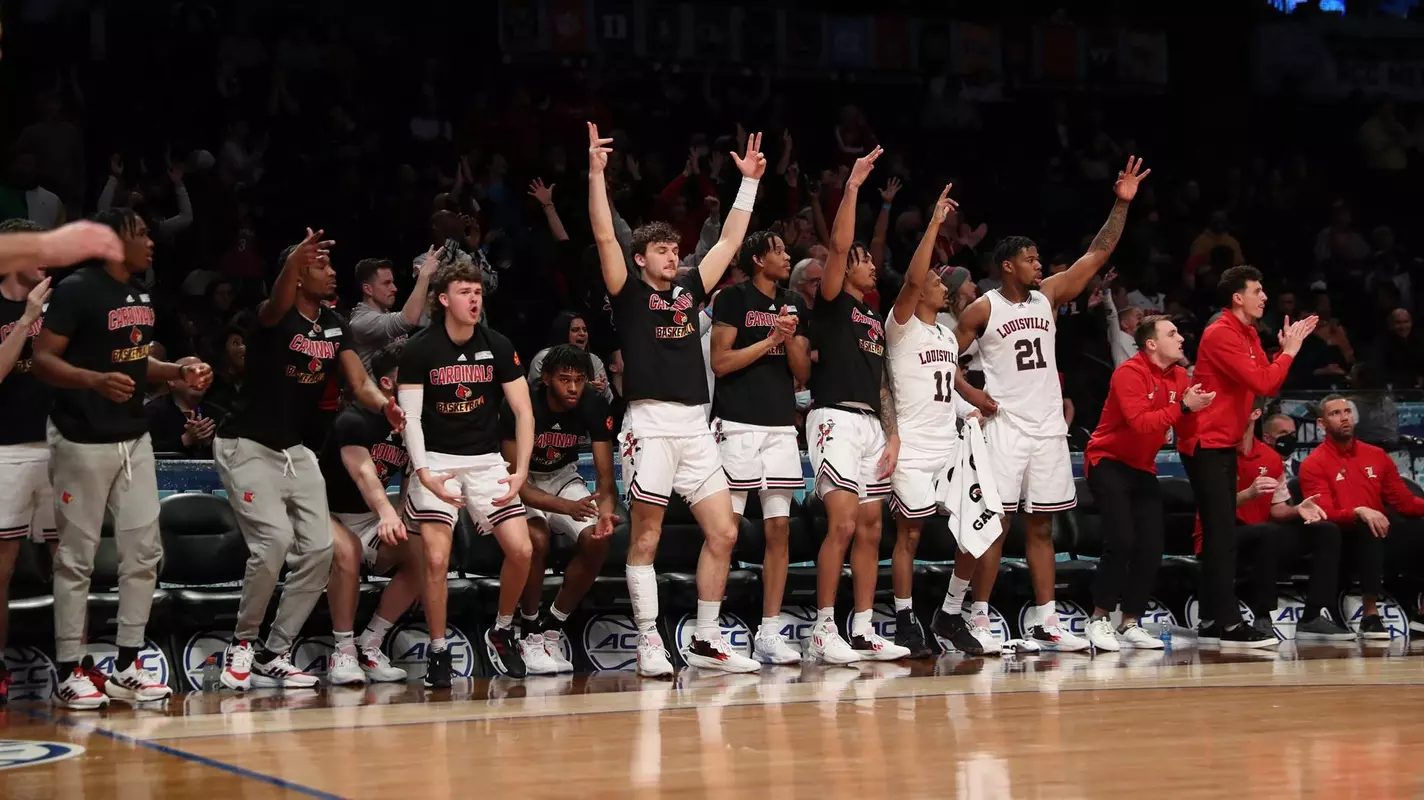 The Louisville bench celebrates against Georgia Tech in Brooklyn.
