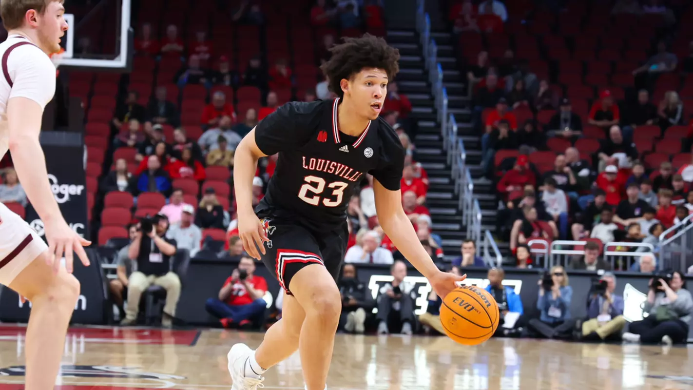Zan Payne drives the ball against Virginia Tech on March 5, 2024, at the KFC Yum! Center.