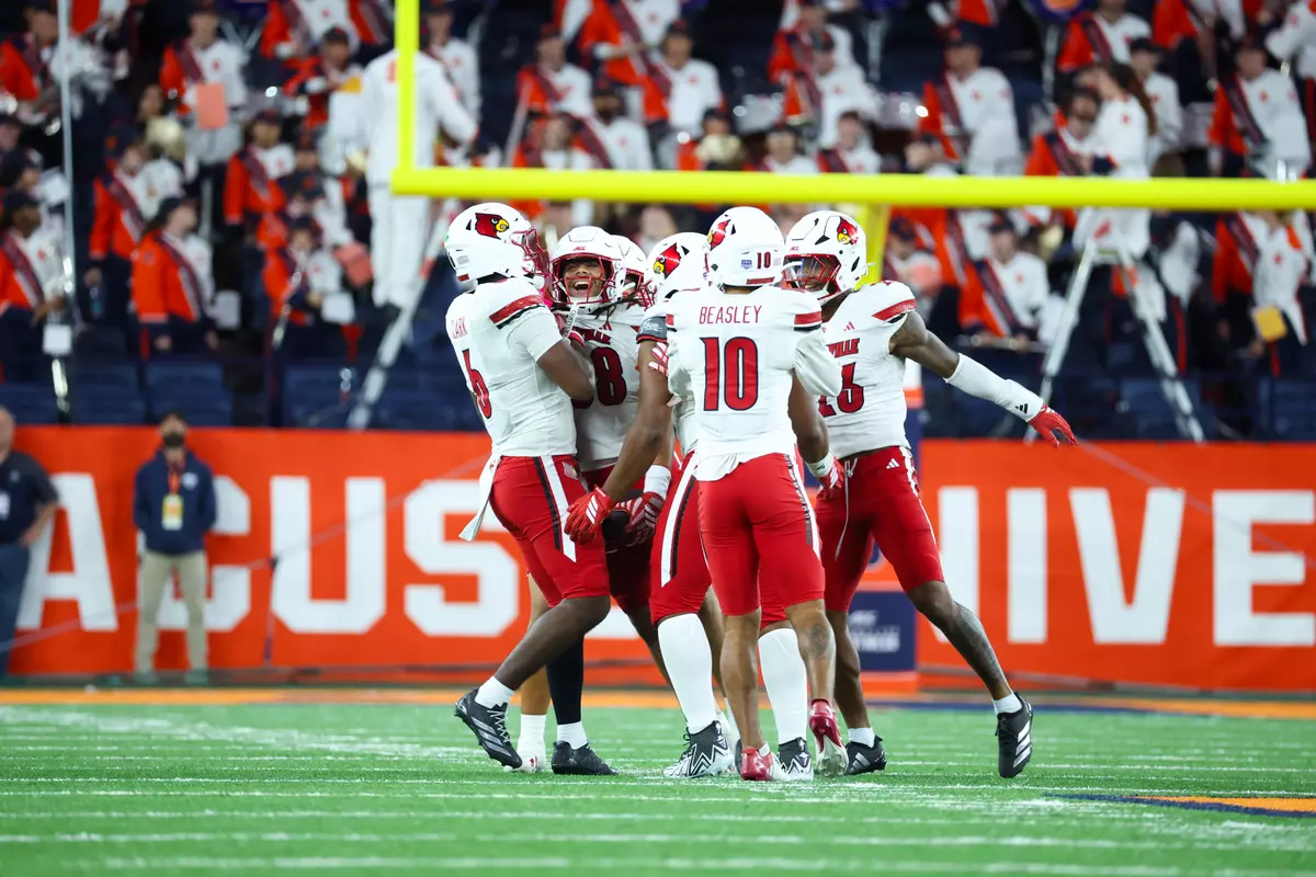 Cards' Defense Celebrates Against Syracuse
