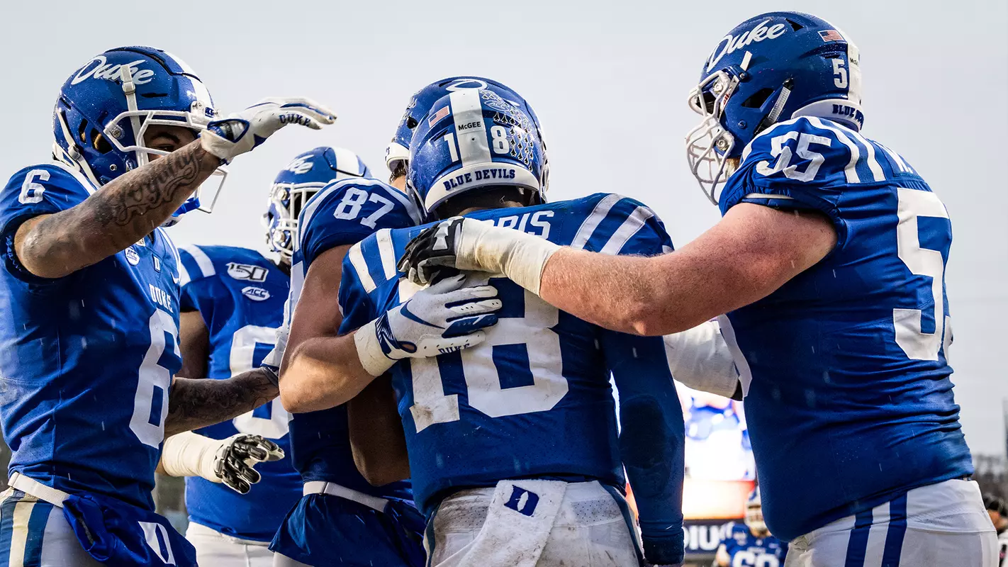 Redshirt senior QB Quentin Harris celebrates a touchdown with teammates
