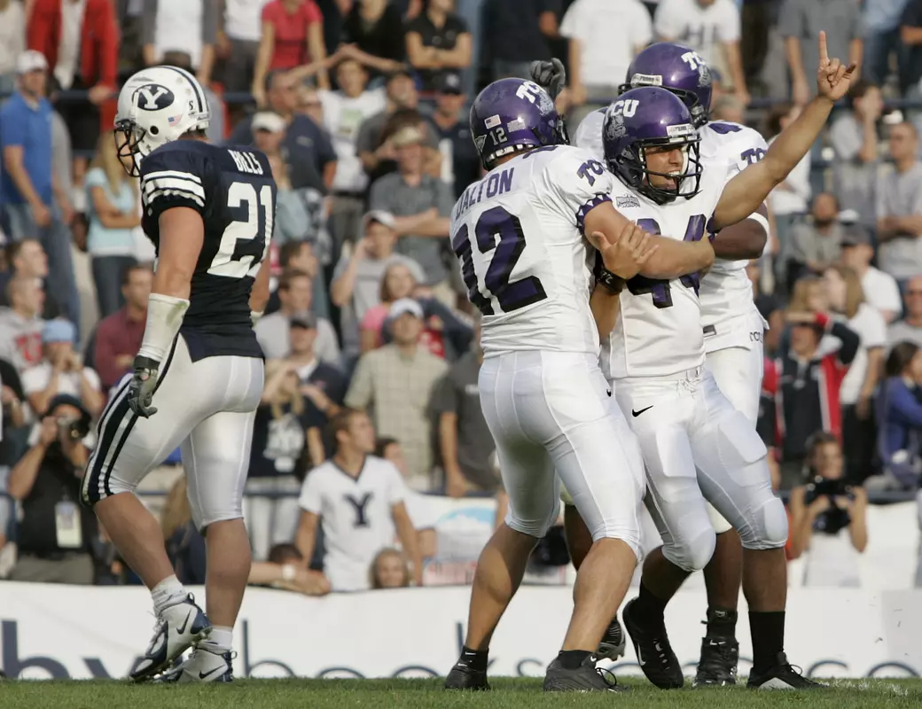 TCU kicker Chris Manfredini (44) celebrates with Reeves Dalton (12) after kicking the winning field goal to beat Brigham Young in overtime. (AP Photo/Douglas C. Pizac)