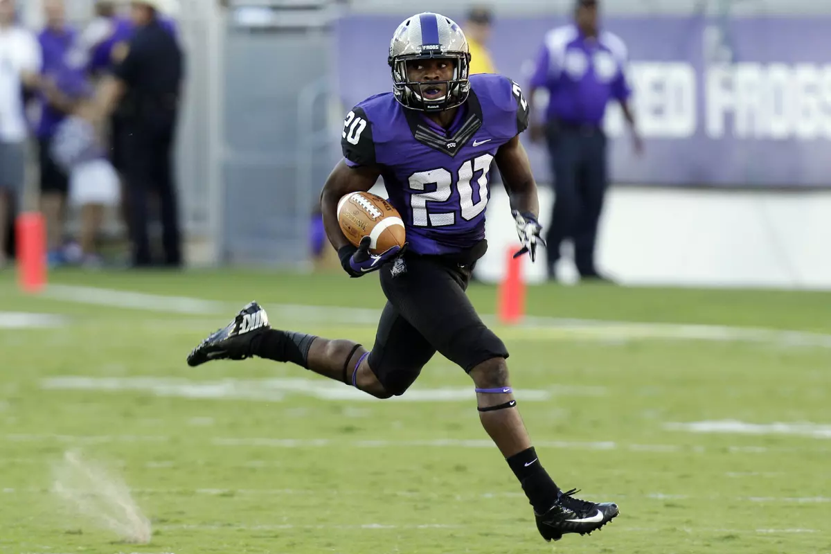 Deante' Gray runs back a punt return for a touchdown during the first half. (AP Photo/LM Otero)
