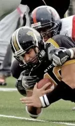Missouri's Chase Daniel scores with Mississippi's Viciente DeLoach on his back in the first half. (AP Photo/James A. Finley)
