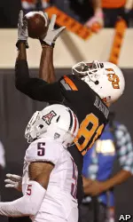 WR Justin Blackmon reaches for a touchdown catch in the third quarter.