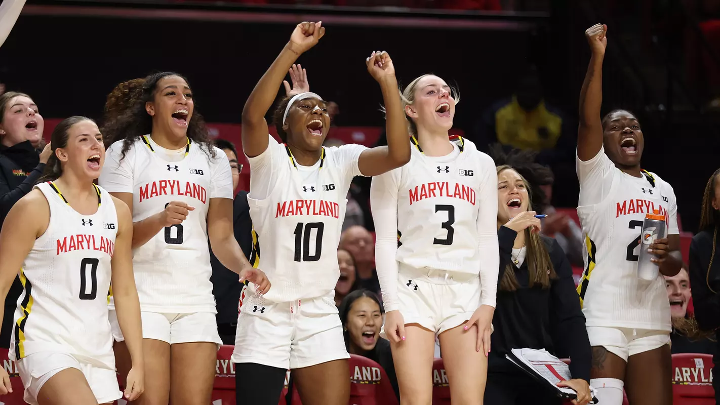 Maryland's bench celebrates a basket against VT