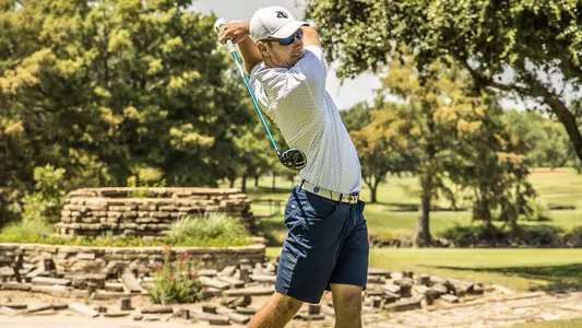 Alex Clouse hits a tee shot