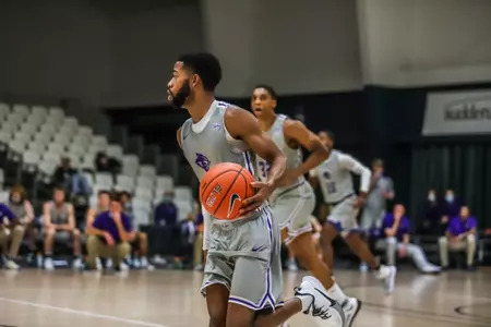 Reggie Miller brings the ball up the court against McMurry, Dec. 2020