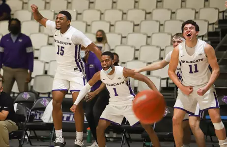 Wildcats celebrate on the sideline against HPU