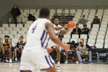 Immanuel Allen passes ball to Damien Daniels during Dec. 1 game vs. HPU.